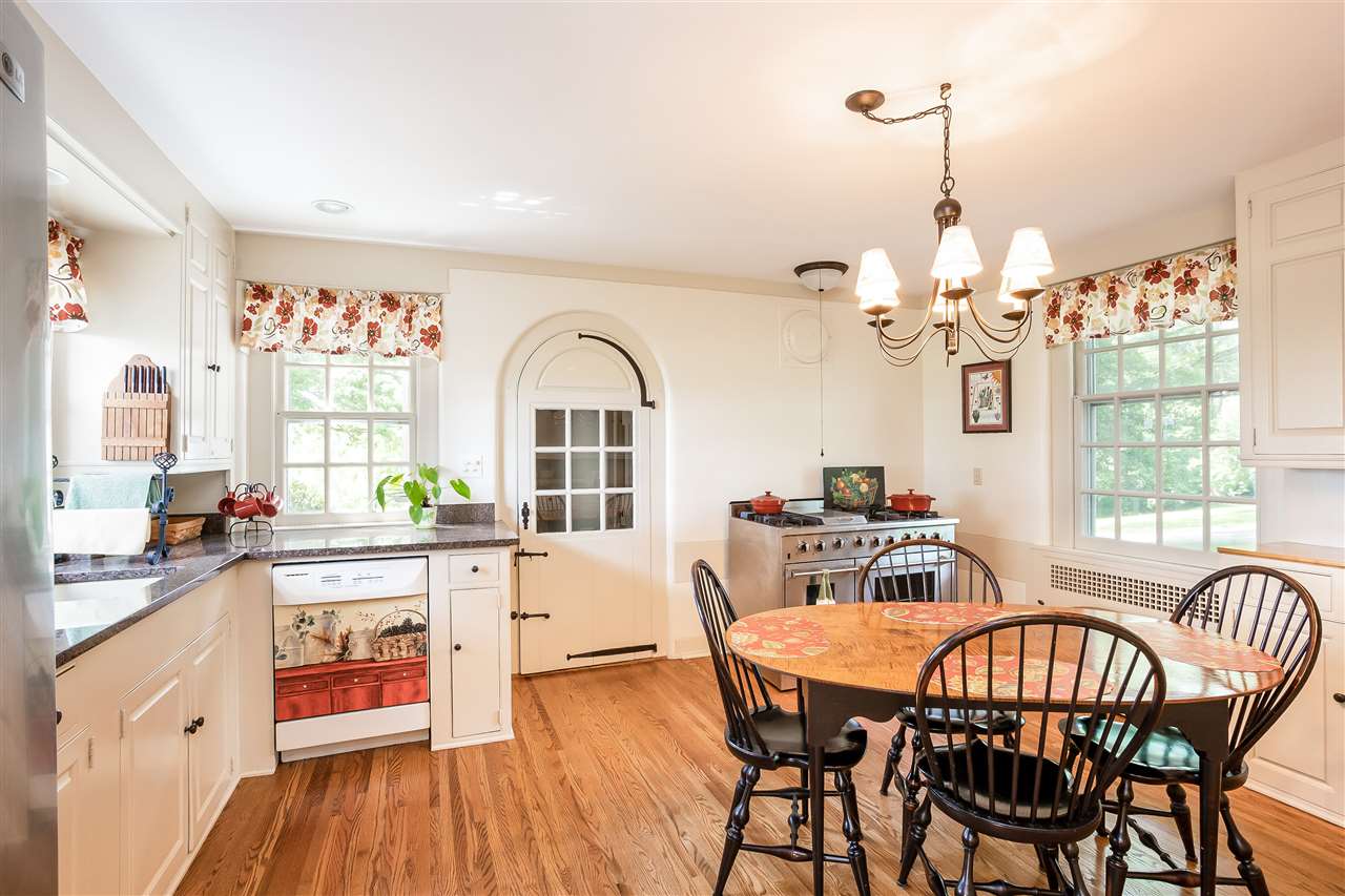 388 Rockfish Road Waynesboro, VA 22980 - Photo 15 of 50 a view of a dining room with furniture a chandelier and wooden floor
