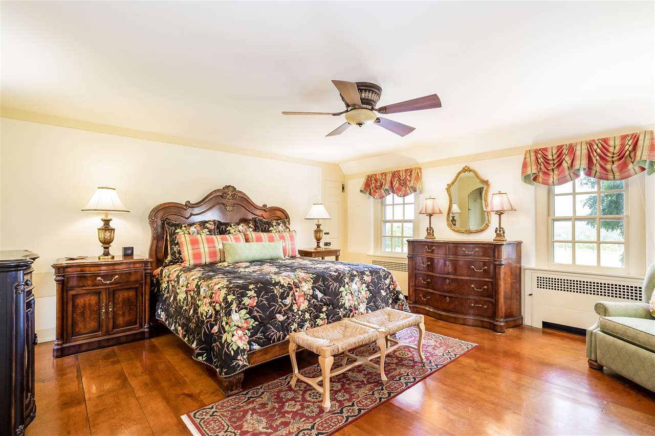 388 Rockfish Road Waynesboro, VA 22980 - Photo 33 of 50 a bedroom with a bed and wooden floor