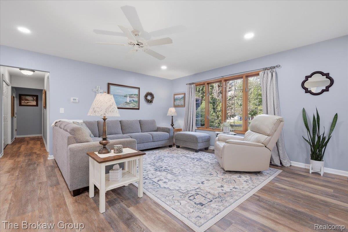 5461 North Henderson Road Davison, MI 48423 - Photo 14 of 64 Living area featuring wood-finish flooring, recessed lighting, and a multi-pane window with wood trim