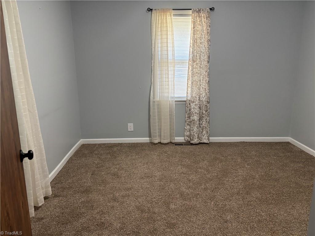 2327 Scalesville Road Summerfield, NC 27358 - Photo 16 of 28 2ND BEDROOM WITH THE BARN DOOR
