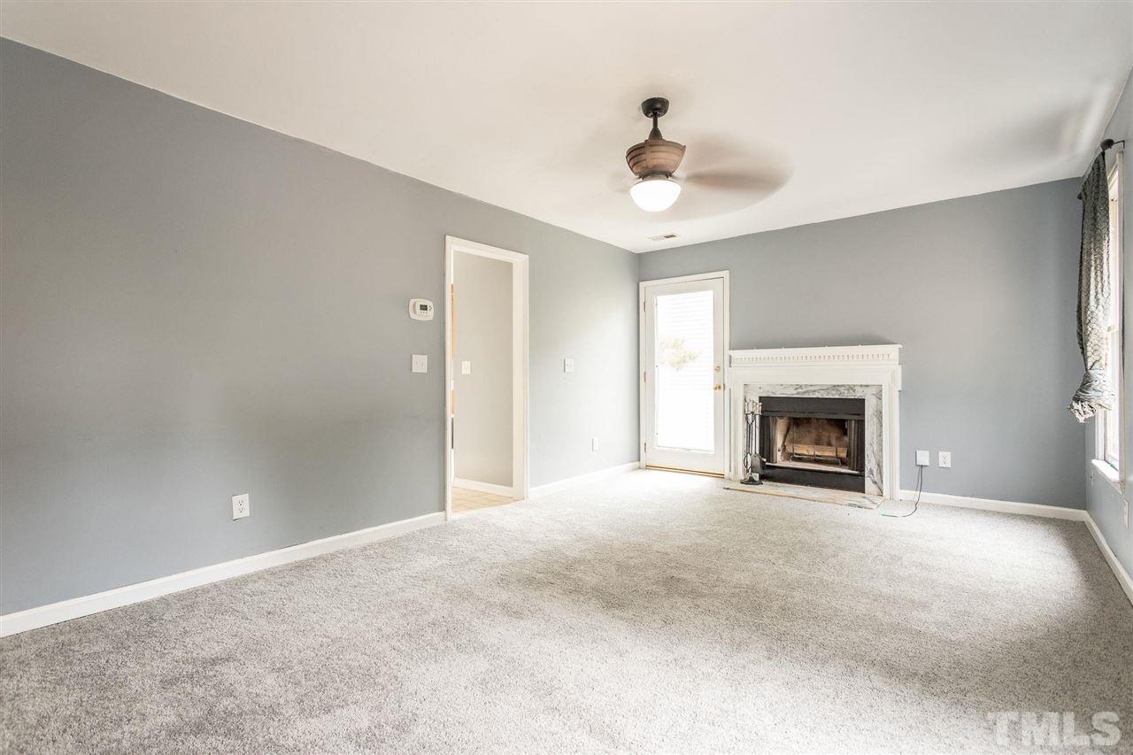 4116 Iron Horse Road Raleigh, NC 27616 - Photo 12 of 29 a view of an empty room with a fireplace