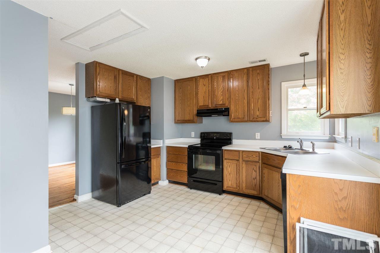 4116 Iron Horse Road Raleigh, NC 27616 - Photo 15 of 29 a kitchen with stainless steel appliances granite countertop a refrigerator stove and sink