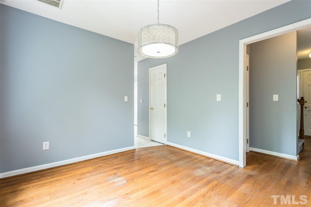 4116 Iron Horse Road Raleigh, NC 27616 - Photo 17 of 29 a view of an empty room with wooden floor and a window