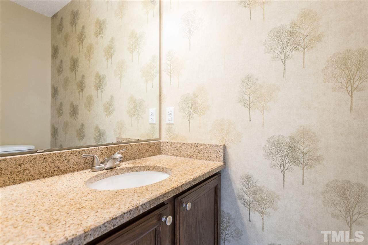 4116 Iron Horse Road Raleigh, NC 27616 - Photo 19 of 29 a bathroom with a granite countertop sink and a mirror