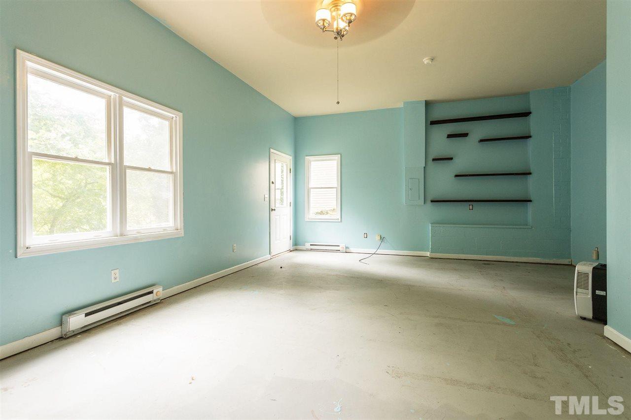 4116 Iron Horse Road Raleigh, NC 27616 - Photo 20 of 29 an empty room with a empty space and windows