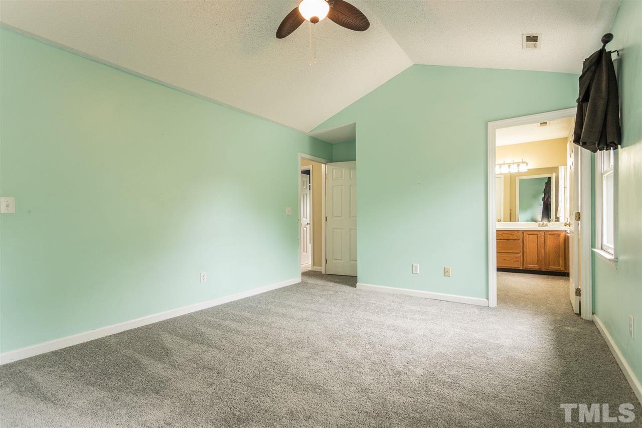 4116 Iron Horse Road Raleigh, NC 27616 - Photo 22 of 29 an empty room with closet and a chandelier fan