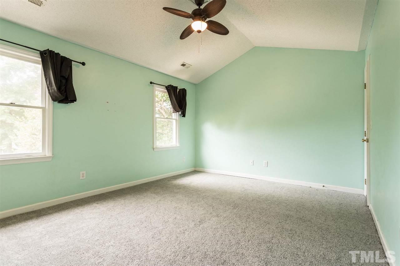 4116 Iron Horse Road Raleigh, NC 27616 - Photo 23 of 29 a view of a livingroom with a ceiling fan and window