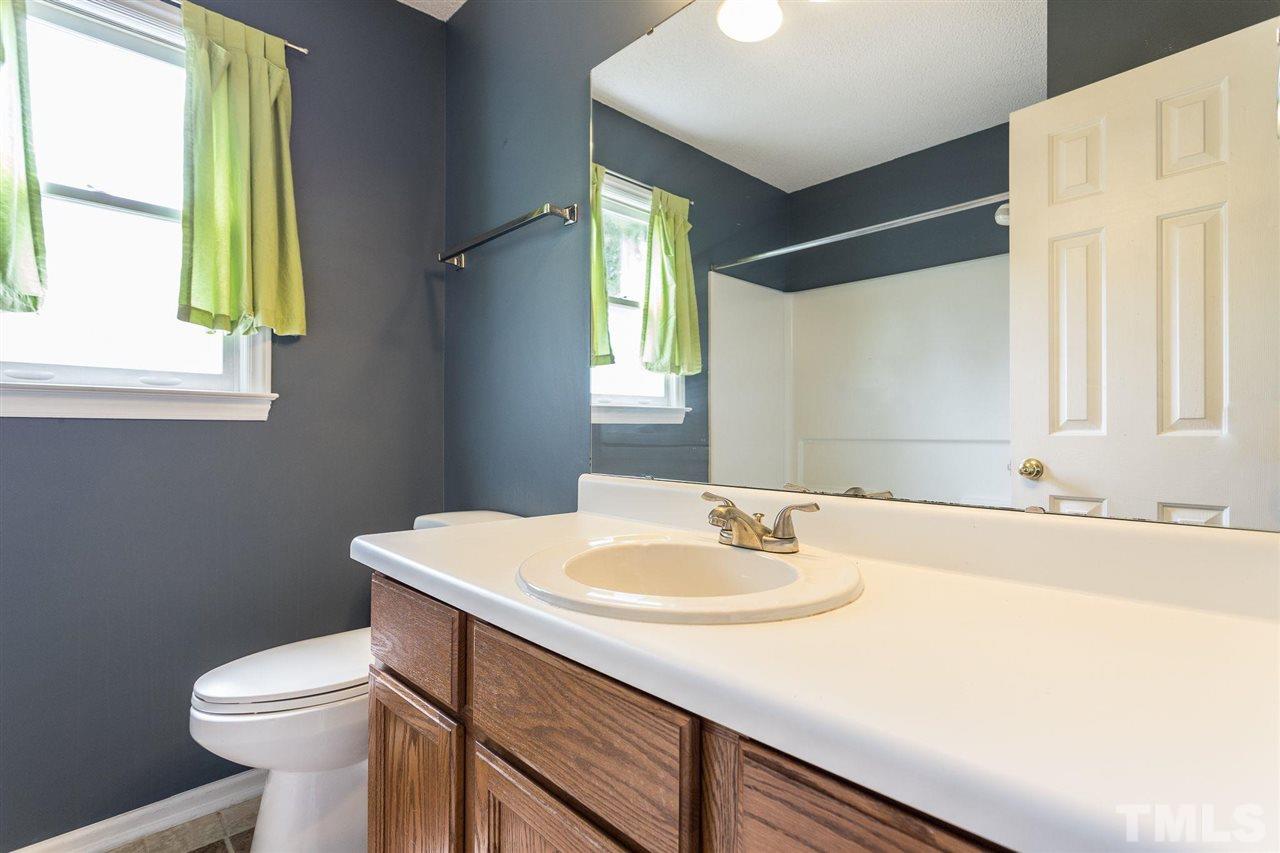 4116 Iron Horse Road Raleigh, NC 27616 - Photo 29 of 29 a bathroom with a sink and a toilet