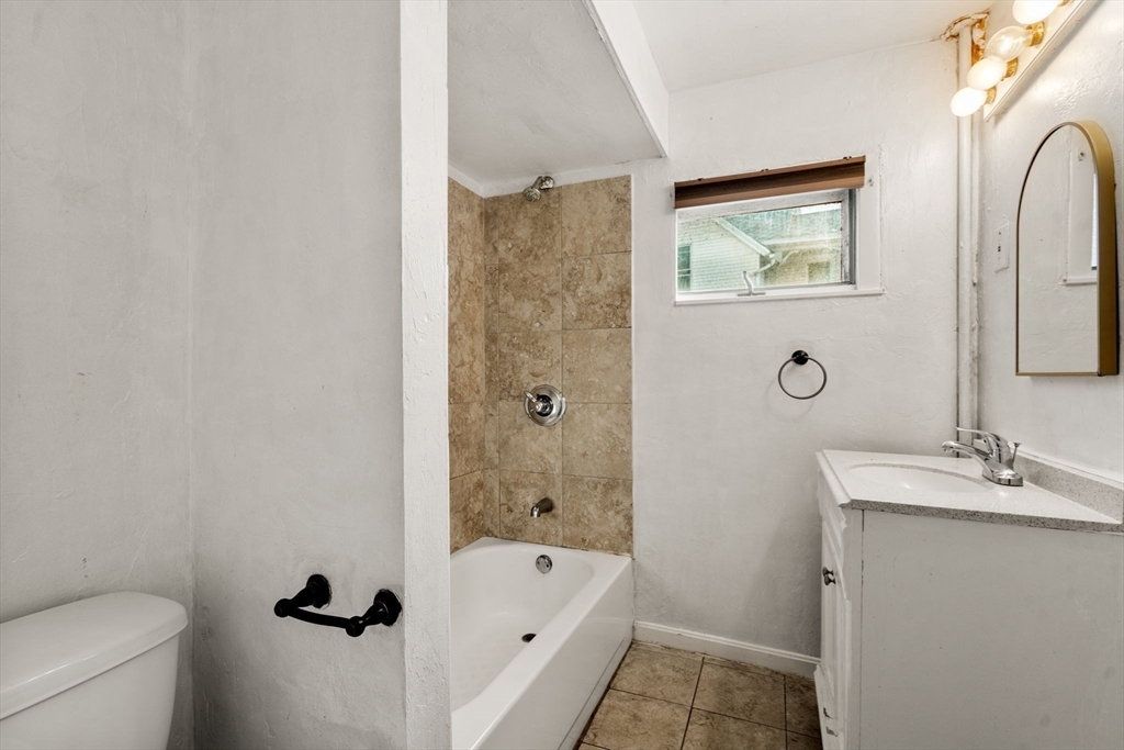 723 Main Street Southbridge, MA 01550 - Photo 14 of 41 a bathroom with a tub sink and mirror