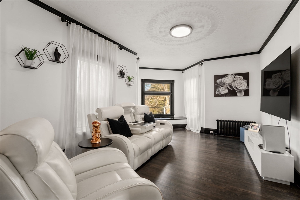 723 Main Street Southbridge, MA 01550 - Photo 19 of 41 a living room with furniture and a flat screen tv