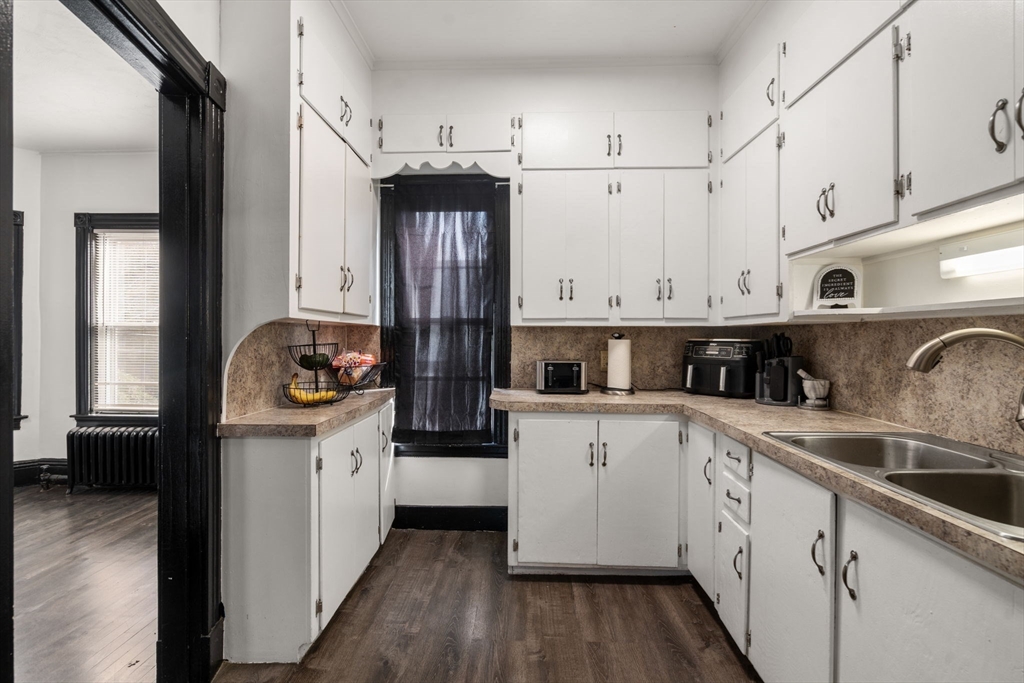 723 Main Street Southbridge, MA 01550 - Photo 27 of 41 a kitchen with granite countertop a white stove top oven sink and cabinets