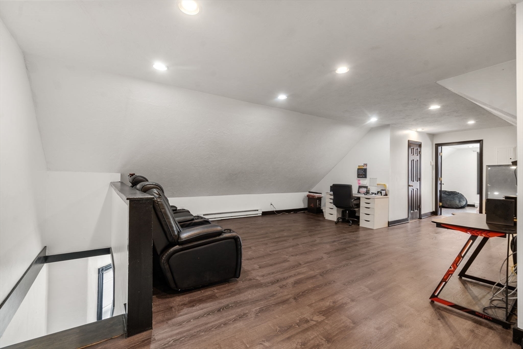 723 Main Street Southbridge, MA 01550 - Photo 31 of 41 a room with furniture and a wooden floor