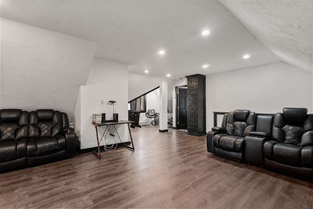723 Main Street Southbridge, MA 01550 - Photo 32 of 41 a living room with furniture and wooden floor