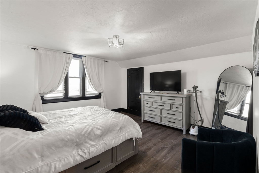 723 Main Street Southbridge, MA 01550 - Photo 33 of 41 a bedroom with furniture and flat screen tv