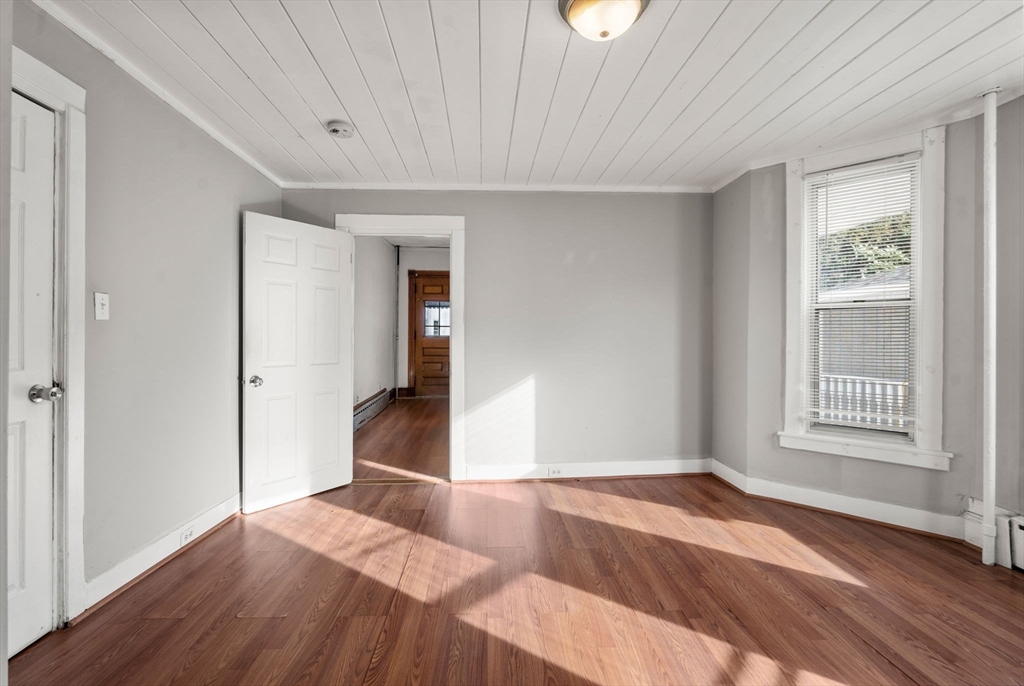 723 Main Street Southbridge, MA 01550 - Photo 7 of 41 a bedroom with a bed and wooden floor