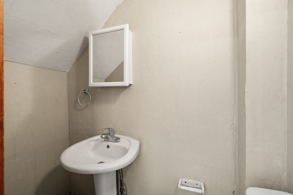 723 Main Street Southbridge, MA 01550 - Photo 10 of 41 a bathroom with a sink and a mirror