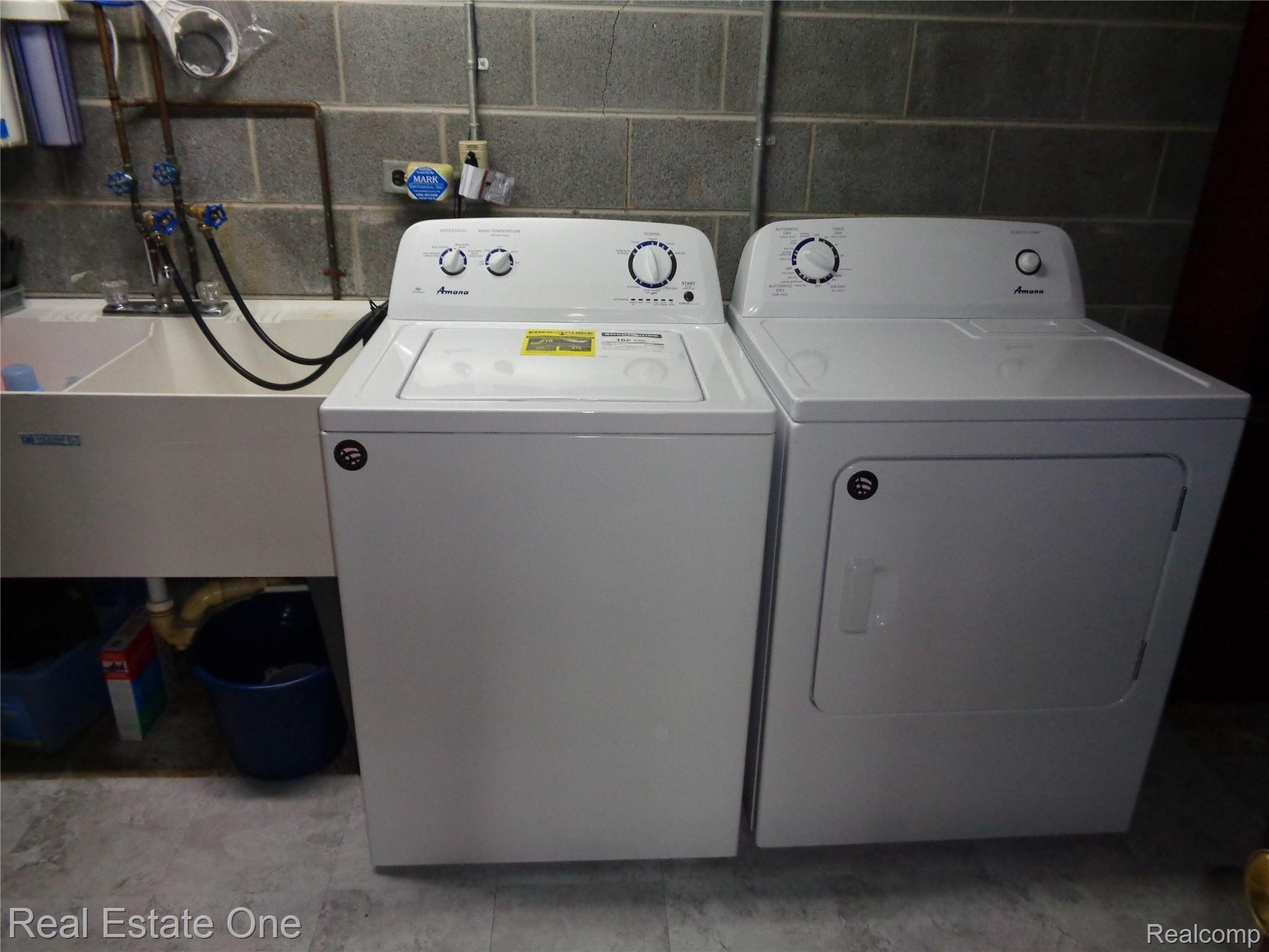 2572 Lake George Road Oakland, MI 48363 - Photo 51 of 83 Lower level laundry room with double utility sink. Washer & dryer INcluded in sale.