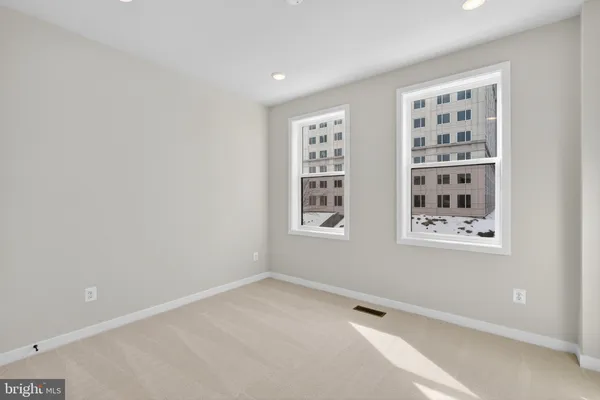 a view of an empty room with windows