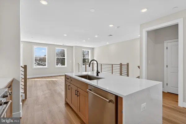 a kitchen with a sink and cabinets