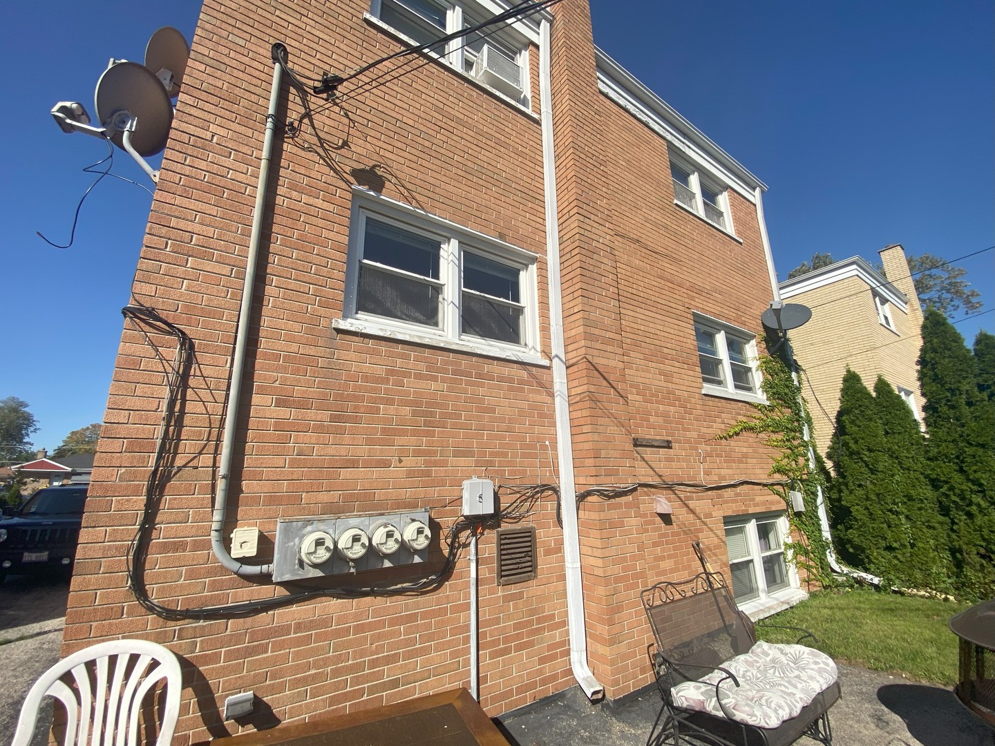 1541 Homestead Road La Grange Park, IL 60526 - Photo 3 of 11 a brick building with a bench and a couch