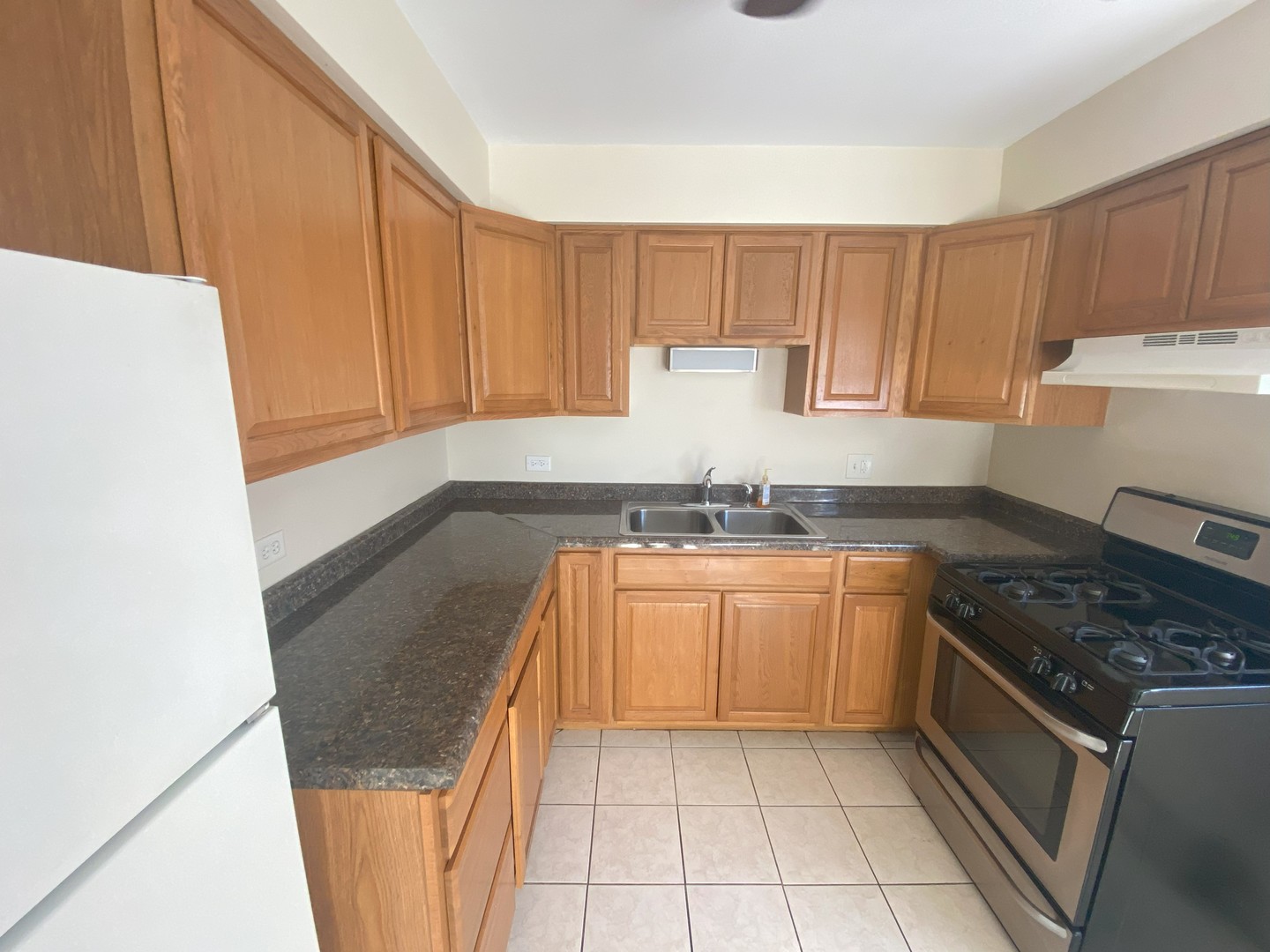 1541 Homestead Road La Grange Park, IL 60526 - Photo 4 of 11 a kitchen with granite countertop a sink stove and cabinets