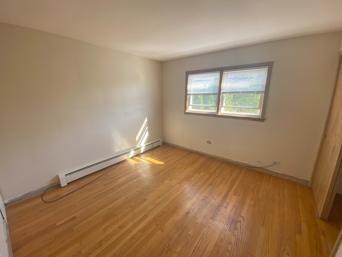 1541 Homestead Road La Grange Park, IL 60526 - Photo 7 of 11 an empty room with wooden floor and windows
