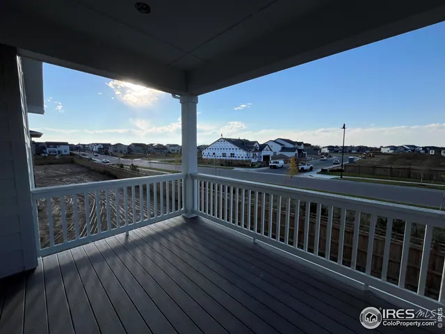 a view of a balcony with wooden floor