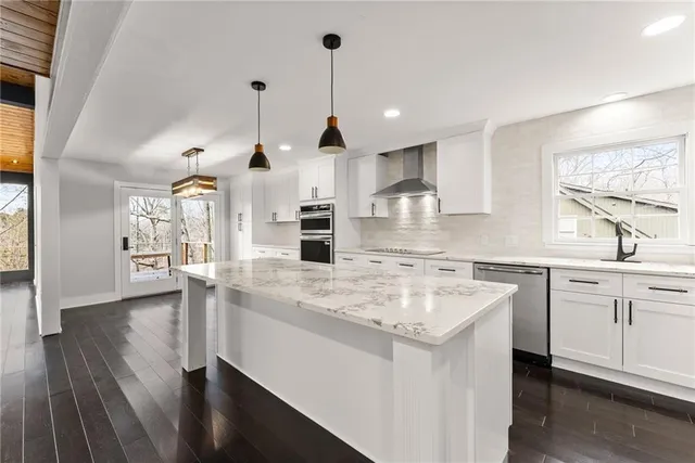 a view of a livingroom with furniture and wooden floor