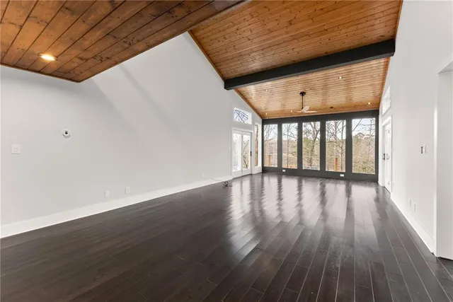 a kitchen with stainless steel appliances a dining table and chairs
