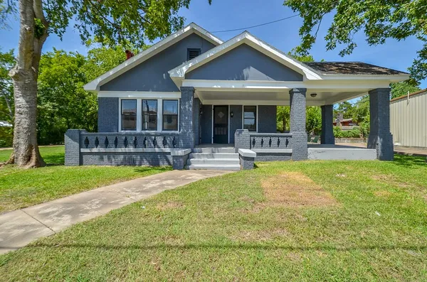 a front view of a house with swimming pool