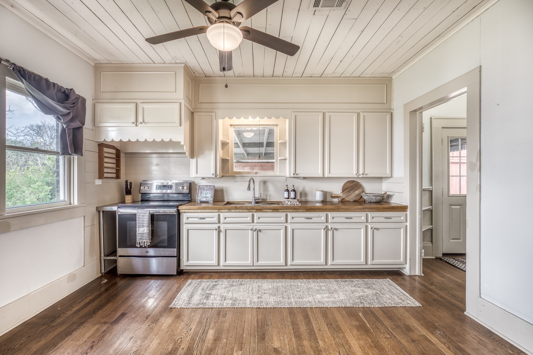 404 West Main Street Bellville, TX 77418 - Photo 11 of 36 a kitchen with stainless steel appliances granite countertop a stove a sink and a refrigerator