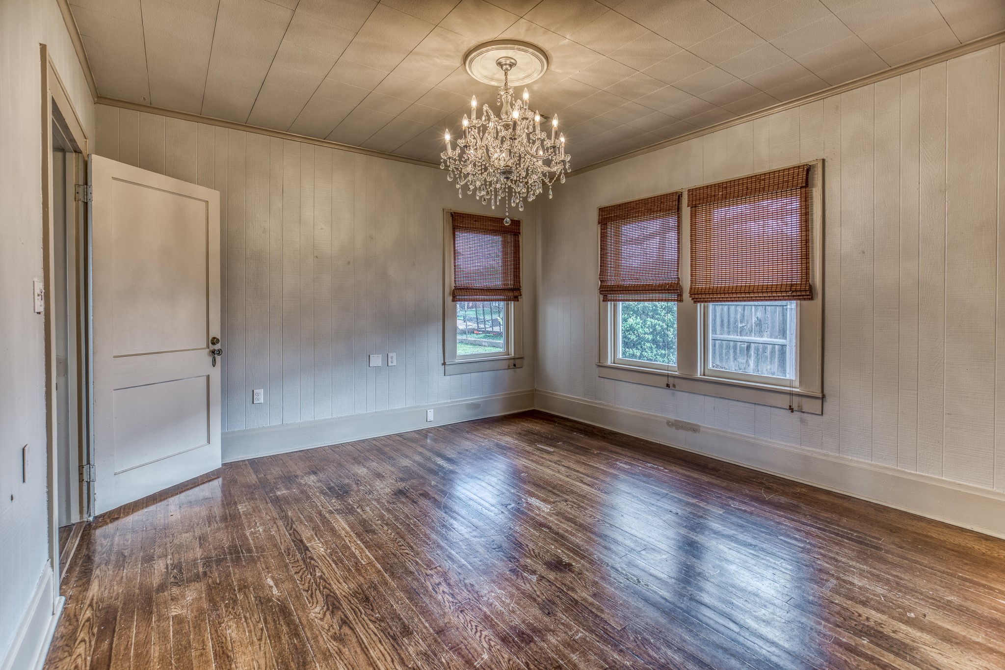 404 West Main Street Bellville, TX 77418 - Photo 12 of 36 a view of an empty room with wooden floor and a window