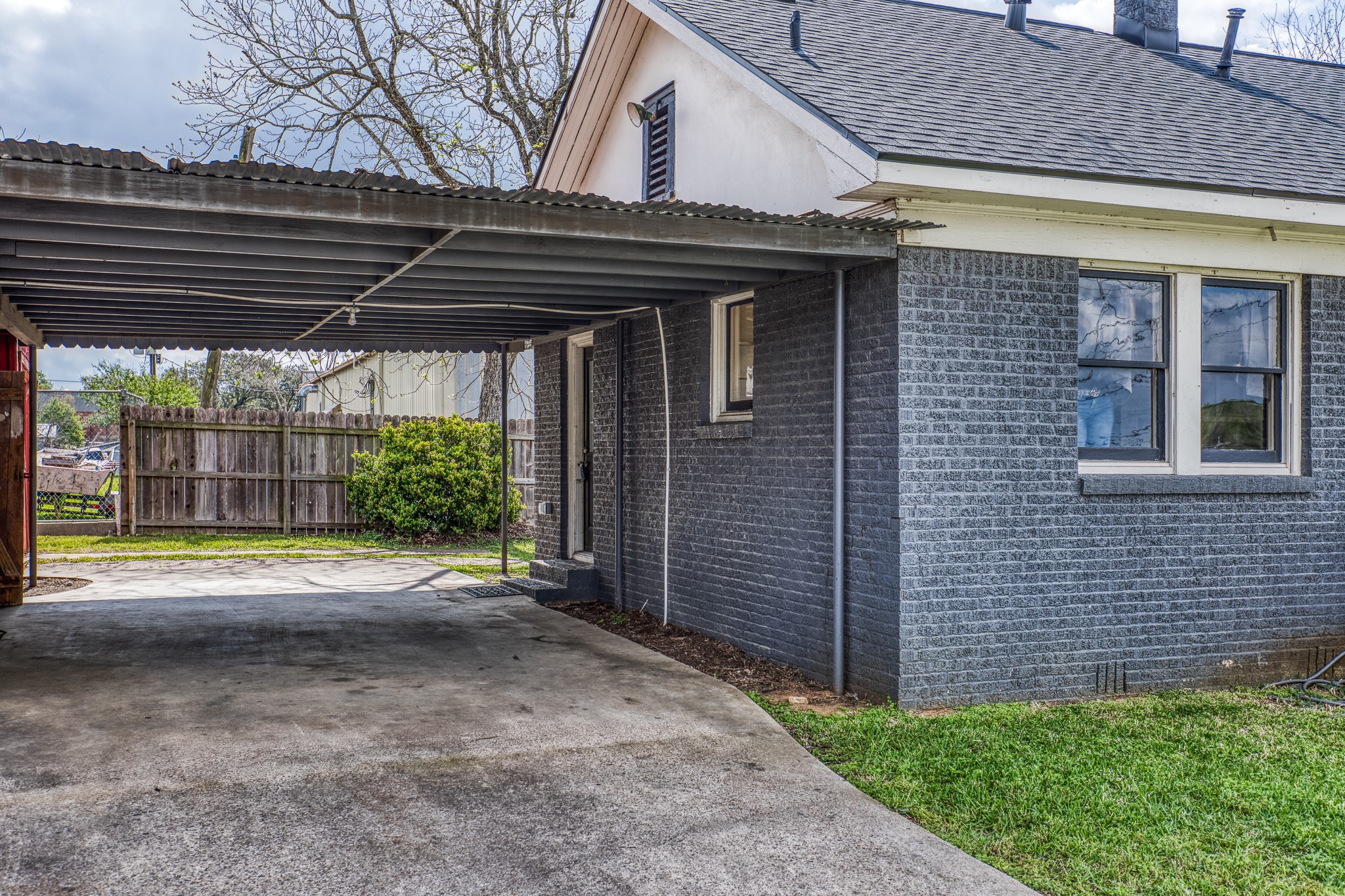 404 West Main Street Bellville, TX 77418 - Photo 24 of 36 a view of backyard with plants and wooden fence
