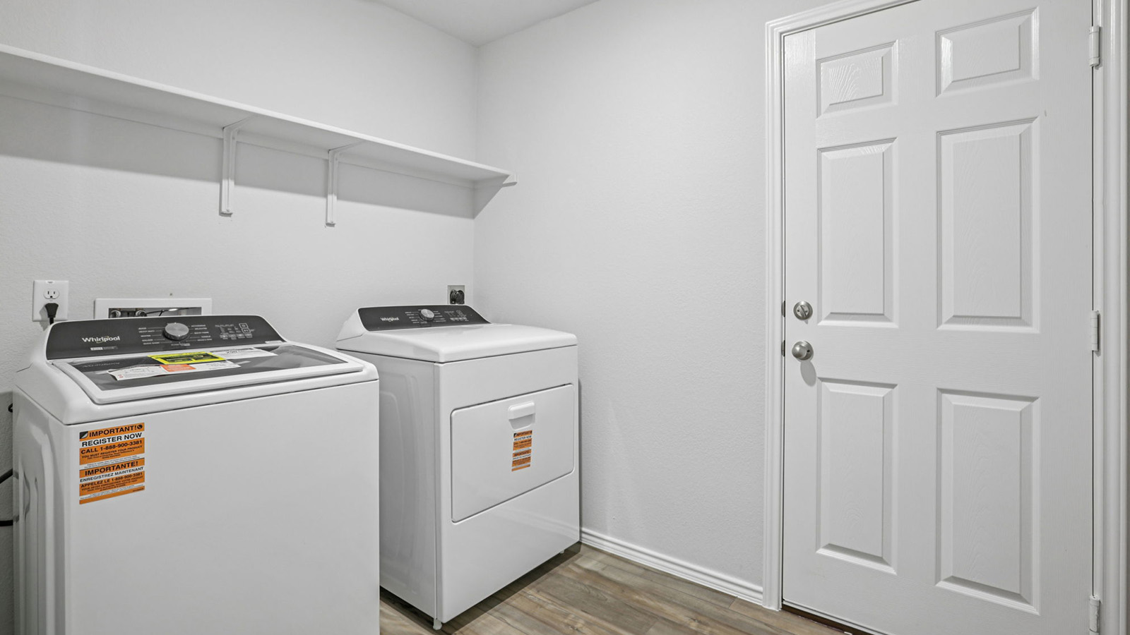 156 Wyatt Way Jarrell, TX 76537 - Photo 29 of 30 Utility room featuring wood-finish flooring and a neutral color palette