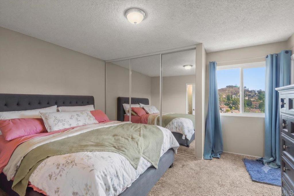 3047 Highlands Boulevard Spring Valley, CA 91977 - Photo 18 of 39 a bed room with two bed and a window