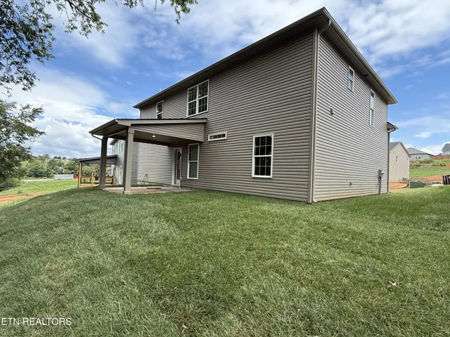 a backyard of a house with lots of green space