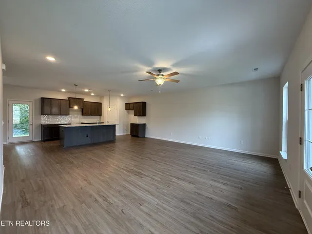 a view of kitchen and kitchen with furniture wooden floor and window