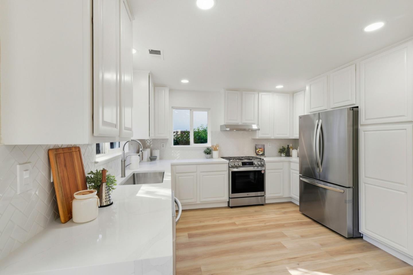 101 Glen Alpine Court Mountain View, CA 94043 - Photo 11 of 38 a kitchen with a refrigerator and a sink