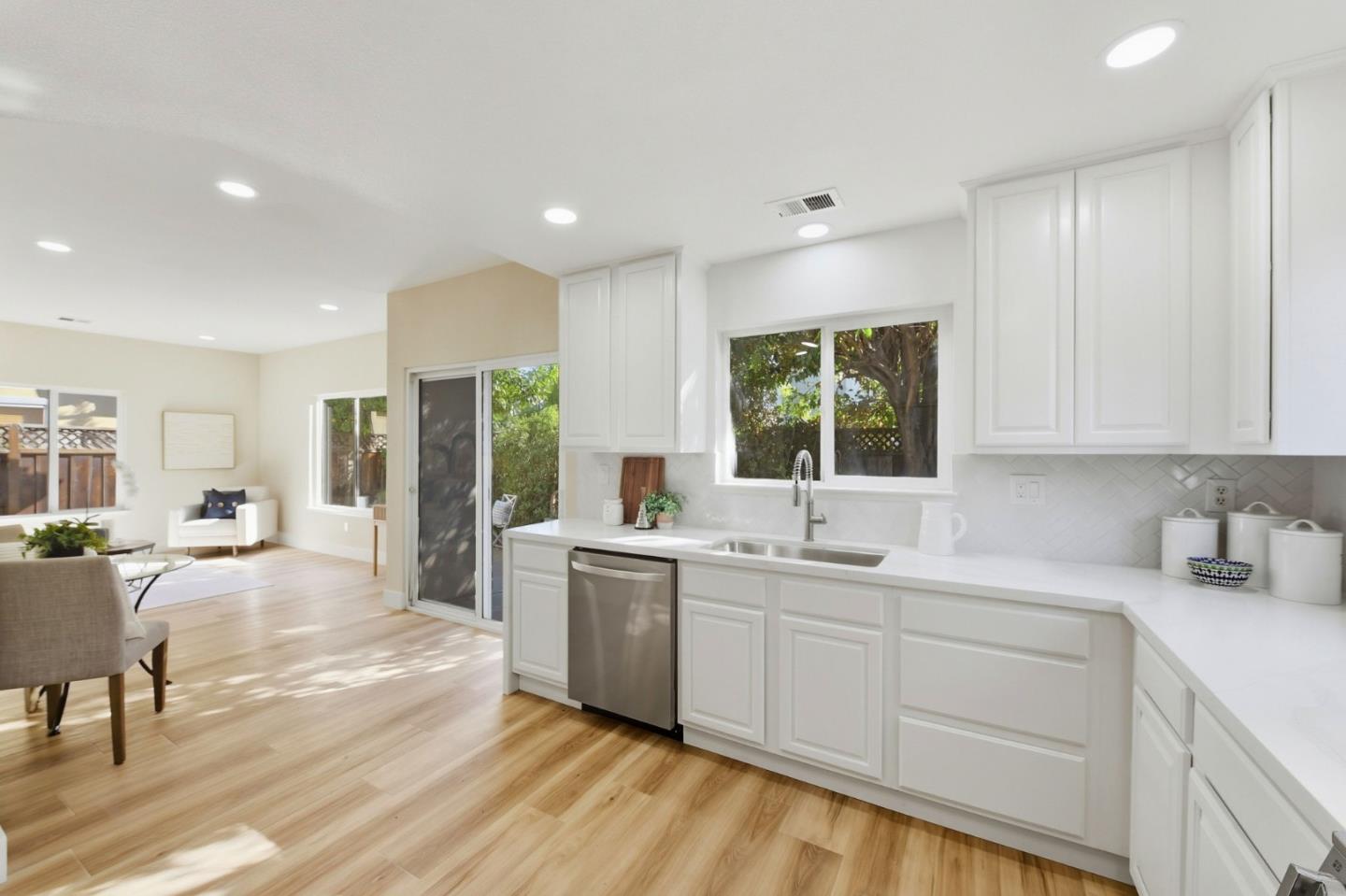101 Glen Alpine Court Mountain View, CA 94043 - Photo 12 of 38 a kitchen with lots of counter top space and painting on the wall