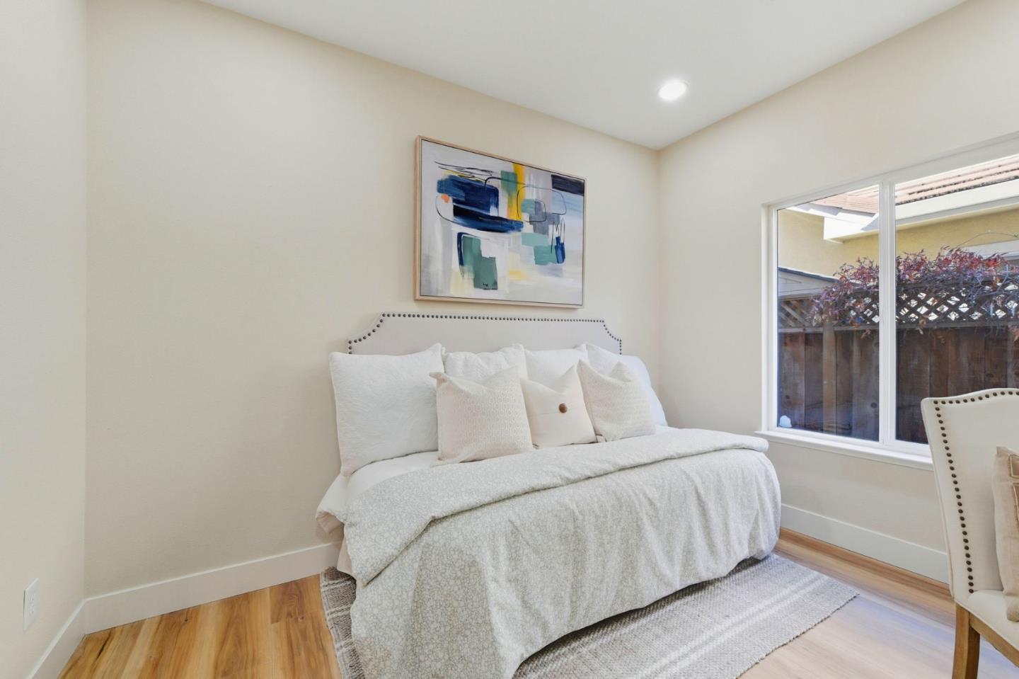 101 Glen Alpine Court Mountain View, CA 94043 - Photo 16 of 38 a bedroom with a large bed and a large window