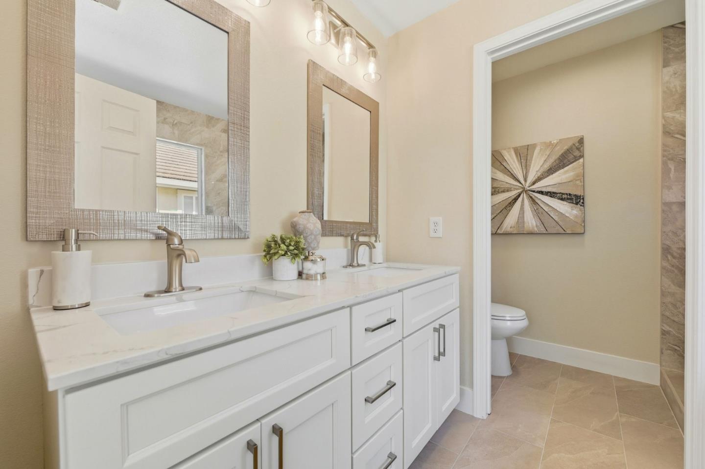 101 Glen Alpine Court Mountain View, CA 94043 - Photo 22 of 38 a bathroom with a double vanity sink and a mirror