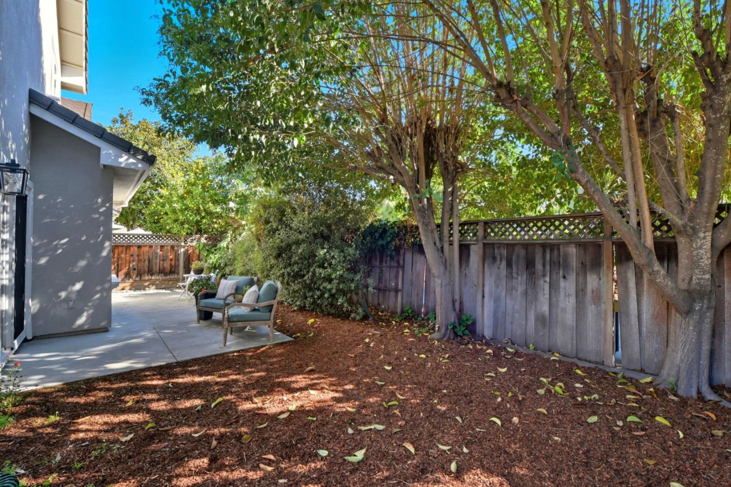 101 Glen Alpine Court Mountain View, CA 94043 - Photo 36 of 38 a view of a backyard with large trees and wooden fence
