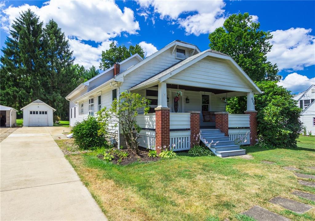 Lovely covered front porch and long drive for plenty of off=street parking.