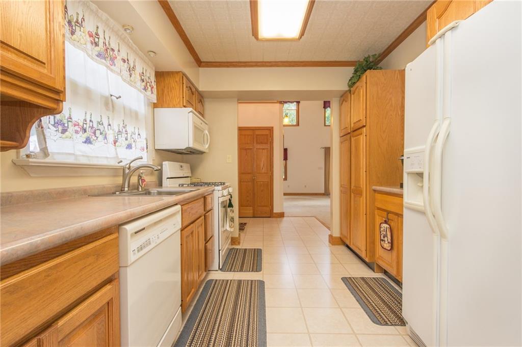 Wide galley style kitchen and all appliances stay!