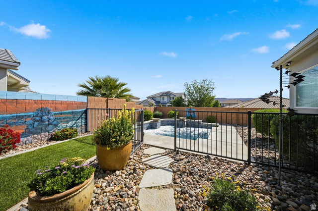 2829 East 1880th Street South St. George, UT 84790 - Photo 36 of 54 View of pool with patio surround and a fenced backyard