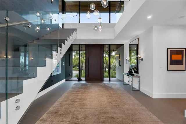 a bathroom with a granite countertop toilet a sink and a shower