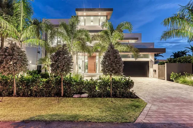 a view of a chairs and table in the patio and a swimming pool