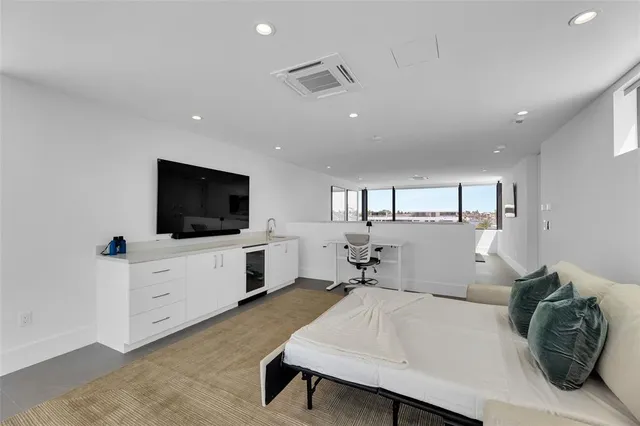 a work room with furniture and a gate