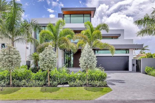 a view of a backyard with a patio and swimming pool