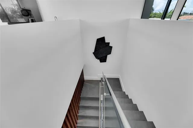 a kitchen with a sink and a stove top oven